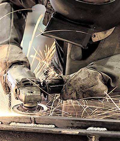 Worker working in JCBL plant.
